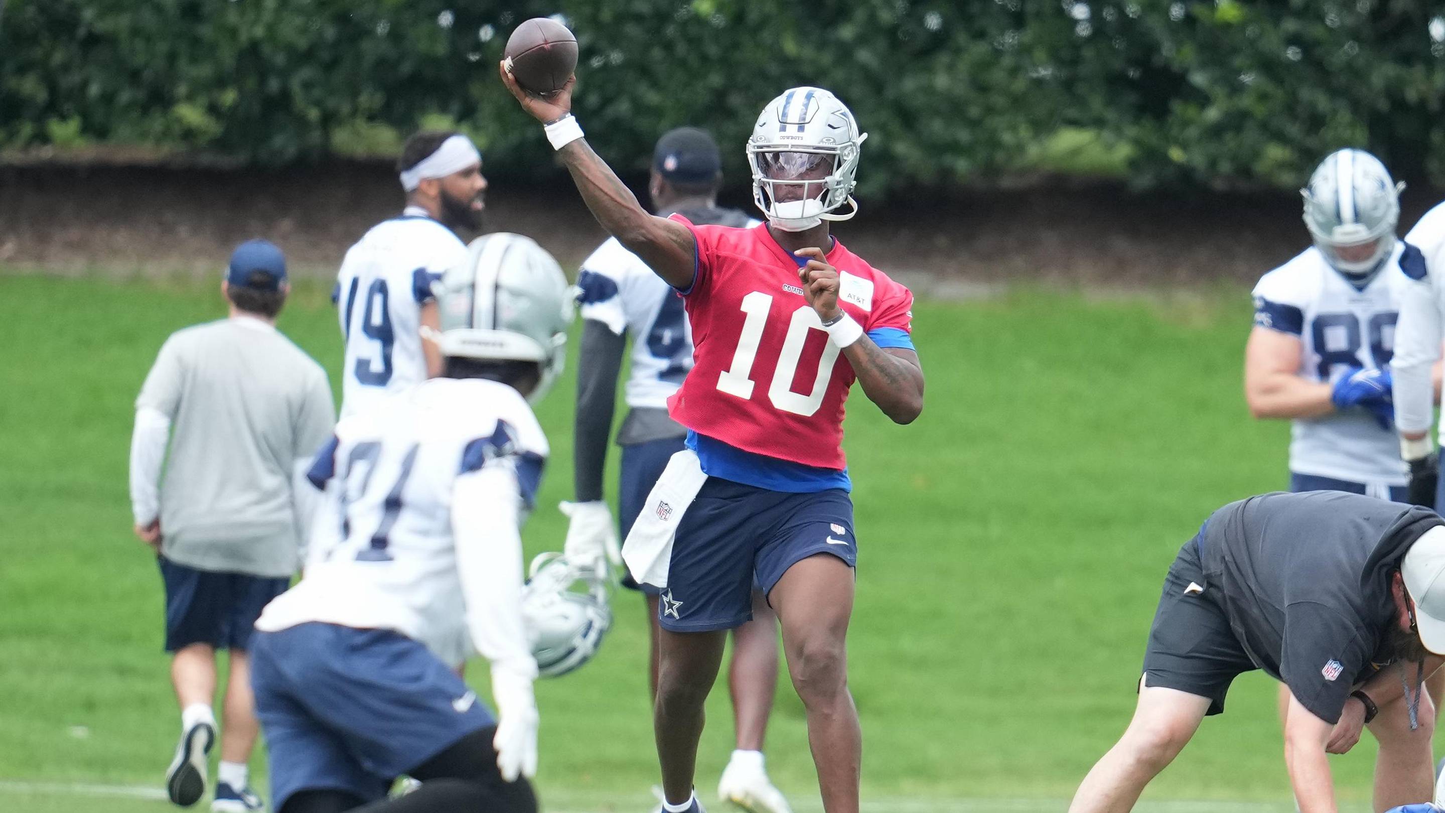 Dallas Cowboys quarterback Joe Milton III and wide receiver Jonathan Mingo go through a drill during minicamp.