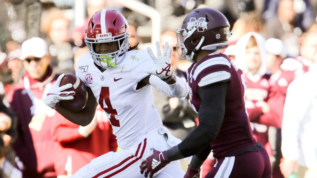 Alabama wide receiver Jerry Jeudy (4) stiff arms a defender but was called for an offensive face mask penalty, negating a touchdown against Mississippi State Saturday, Nov. 16, 2019 in Starkville. [Staff Photo/Gary Cosby Jr.]

Alabama Vs Mississippi State