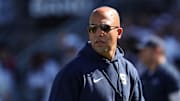 Penn State coach James Franklin walks on the field during a warmup prior to the game against the UCLA Bruins at Beaver Stadium. 