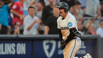 Mar 27, 2025; Miami, Florida, USA; Miami Marlins catcher Nick Fortes (4) reacts from third base after hitting a triple against the Pittsburgh Pirates during the ninth inning at loanDepot Park. 