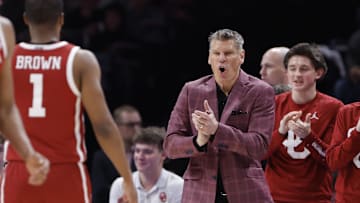 Oklahoma Sooners head coach Porter Moser celebrates after a play against the Oklahoma State Cowboys 