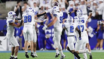 Sep 21, 2024; Provo, Utah, USA; Brigham Young Cougars defensive end Tyler Batty (92) celebrates an interception against the Kansas State Wildcats during the second quarter at LaVell Edwards Stadium. Mandatory Credit: Rob Gray-Imagn Images