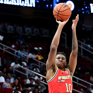 Apr 2, 2024; Houston, TX, USA; McDonald's All American West forward Donavan Freeman (10) shoots a three point basket during the second half against the McDonald's All American East at Toyota Center. Mandatory Credit: Maria Lysaker-Imagn Images