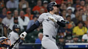 Sep 4, 2025; Houston, Texas, USA; New York Yankees third baseman Ryan McMahon (19) hits an RBI single against the Houston Astros in the second inning at Daikin Park. Mandatory Credit: Thomas Shea-Imagn Images