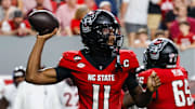 Sep 27, 2025; Raleigh, North Carolina, USA; North Carolina State Wolfpack quarterback CJ Bailey (11) with the ball during the first half of the game against Virginia Tech Hokies at Carter-Finley Stadium. Mandatory Credit: Jaylynn Nash-Imagn Images