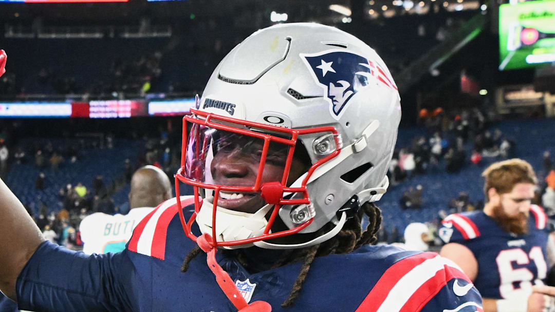 New England Patriots running back Rhamondre Stevenson walks on the field after the game against the Miami Dolphins.