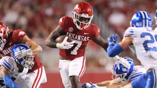 Arkansas Razorbacks running back Rashod Dubinion on a rushing attempt during a college football game in the SEC.