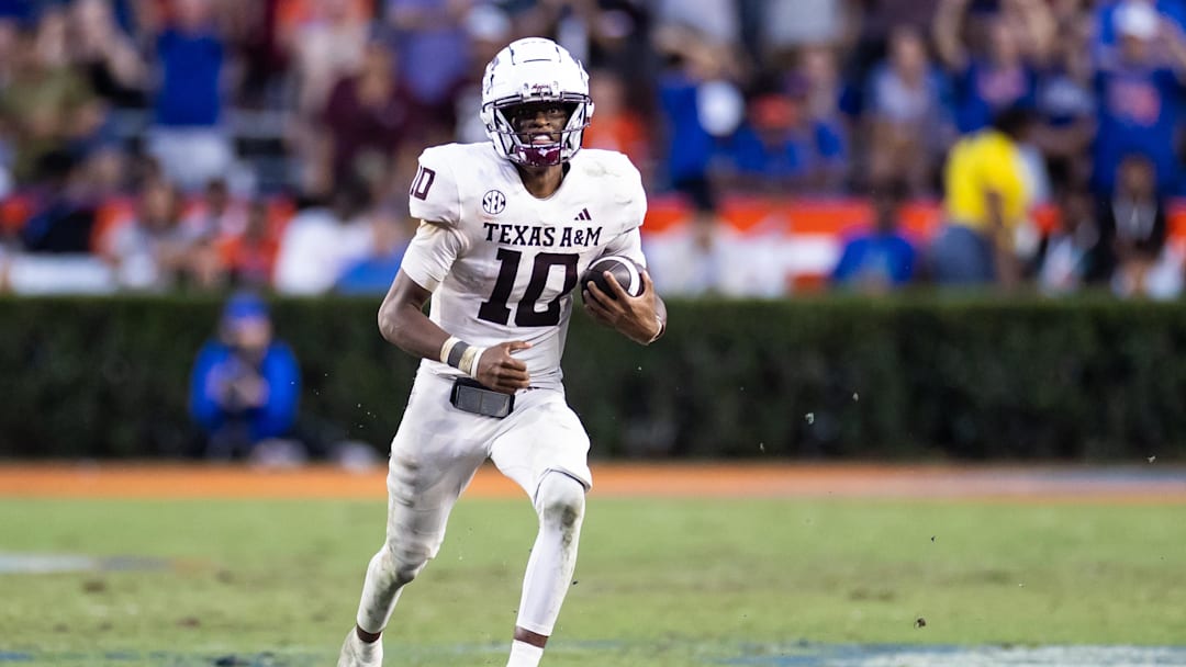 Sep 14, 2024; Gainesville, Florida, USA; Texas A&M Aggies quarterback Marcel Reed (10) runs with the ball against the Florida Gators during the second half at Ben Hill Griffin Stadium. Mandatory Credit: Matt Pendleton-Imagn Images