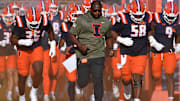 Nov 15, 2025; Champaign, Illinois, USA; The Illinois Fighting Illini take the field before a game against the Maryland Terrapins at Memorial Stadium. Mandatory Credit: Ron Johnson-Imagn Images