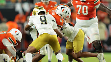 Aug 31, 2025; Miami Gardens, Florida, USA; Miami Hurricanes running back CharMar Brown (6) rushes the ball against the Notre Dame Fighting Irish at Hard Rock Stadium. Mandatory Credit: Sam Navarro-Imagn Images