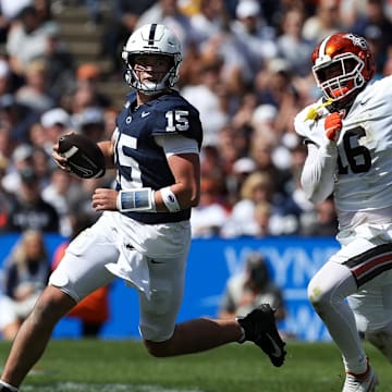 Penn State quarterback Drew Allar evades Bowling Green Falcons defensive linesman Chace Davis during the third quarter at Beaver Stadium. 