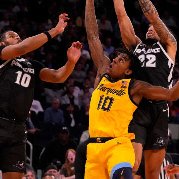 Mar 15, 2024; New York City, NY, USA;  Marquette Golden Eagles guard Zaide Lowery (10), Providence Friars forward Rich Barron (10) and guard Devin Carter (22) fight for a rebound during the second half at Madison Square Garden. Mandatory Credit: Robert Deutsch-USA TODAY Sports