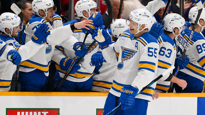 Feb 2, 2026; Nashville, Tennessee, USA;  St. Louis Blues defenseman Colton Parayko (55) celebrates with his teammates after scoring a goal against the Nashville Predators during the second period at Bridgestone Arena. Mandatory Credit: Steve Roberts-Imagn Images