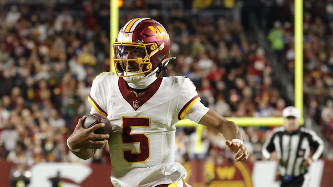 Nov 2, 2025; Landover, Maryland, USA; Washington Commanders quarterback Jayden Daniels (5) runs the ball against the Seattle Seahawks during the first half at Northwest Stadium. Mandatory Credit: Amber Searls-Imagn Images