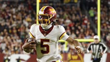 Nov 2, 2025; Landover, Maryland, USA; Washington Commanders quarterback Jayden Daniels (5) runs the ball against the Seattle Seahawks during the first half at Northwest Stadium. Mandatory Credit: Amber Searls-Imagn Images