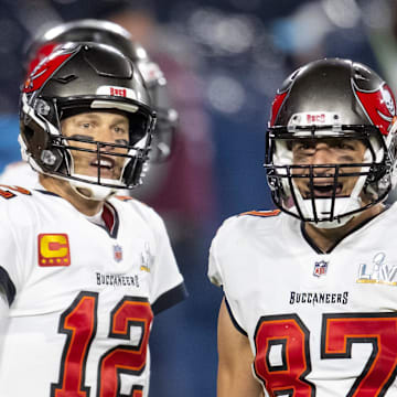 Tampa Bay Buccaneers running back Leonard Fournette with quarterback Tom Brady and tight end Rob Gronkowski.