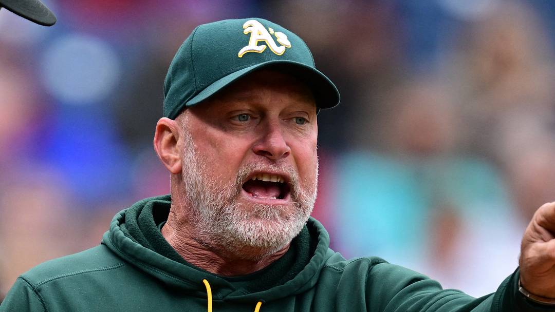 Sep 20, 2026; Cleveland, Ohio, USA;  Athletics manager Mark Kotsay (7) argues with umpire Jordan Baker (71) during the fourth inning against the Cleveland Guardians at Progressive Field.  Mandatory Credit: David Dermer-Imagn Images