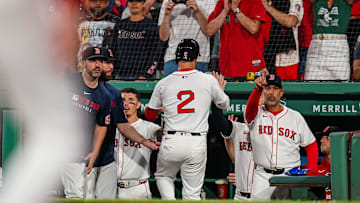 Aug 5, 2025; Boston, Massachusetts, USA; Boston Red Sox third base Alex Bregman (2) is congratulated after scoring against the Kansas City Royals in the seventh inning at Fenway Park. Mandatory Credit: David Butler II-Imagn Images