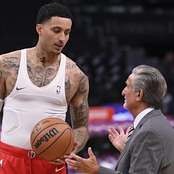 Mar 27, 2024; Washington, District of Columbia, USA;  Washington Wizards forward Kyle Kuzma (33) speaks with Monumental Sports & Entertainment CEO Ted Leonsis before the game against the Brooklyn Nets  at Capital One Arena. Mandatory Credit: Tommy Gilligan-Imagn Images