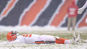 Dec 24, 2017; Chicago, IL, USA; Cleveland Browns defensive end Myles Garrett (95) makes a snow angel in celebration during a game against the Chicago Bears at Soldier Field. The Bears won 20-3. Mandatory Credit: Patrick Gorski-Imagn Images