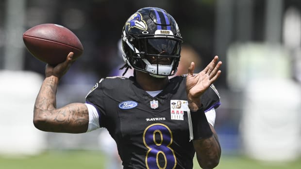 Jul 27, 2024; Owings Mill , MD, USA; Ravens quarterback Lamar Jackson (8) lthrows during the afternoon session of training ca