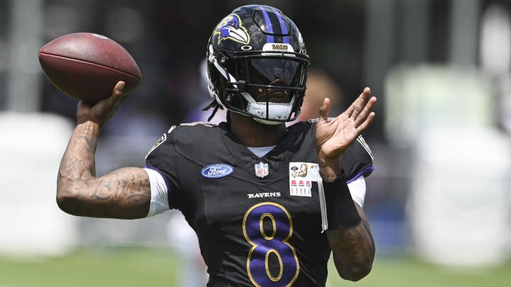 Ravens quarterback Lamar Jackson (8) throws during the afternoon session of training camp at the Under Armour Performance Center.