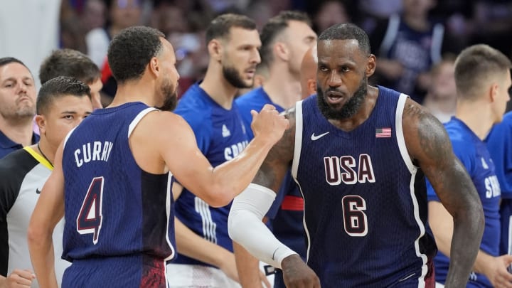 Jul 28, 2024; Villeneuve-d'Ascq, France; United States forward Lebron James (6) and point guard Stephen Curry (4) celebrate after a play  in the third quarter against Serbia during the Paris 2024 Olympic Summer Games at Stade Pierre-Mauroy. Mandatory Credit: John David Mercer-USA TODAY Sports