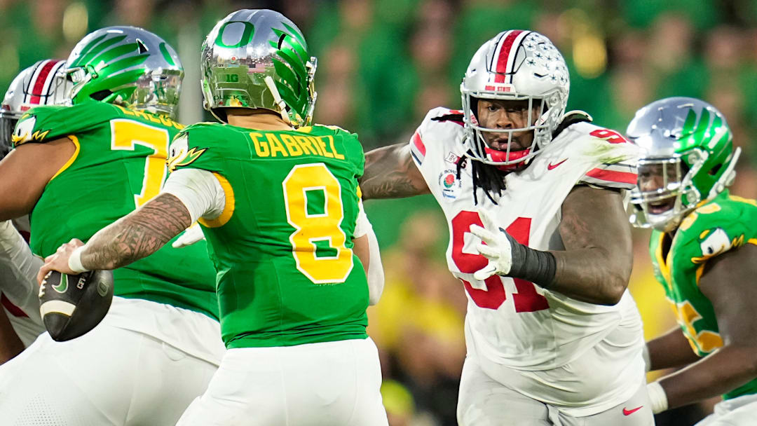 Ohio State Buckeyes defensive tackle Tyleik Williams (91) rushes at Oregon Ducks quarterback Dillon Gabriel (8) during the second half of the College Football Playoff quarterfinal at the Rose Bowl in Pasadena, Calif. on Jan. 1, 2025.