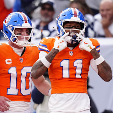 Oct 26, 2025; Denver, Colorado, USA;  Denver Broncos wide receiver Troy Franklin (11) celebrates with wide receiver Courtland Sutton (14) and quarterback Bo Nix (10) after scoring a touchdown against the Dallas Cowboys in the fourth quarter at Empower Field at Mile High. 