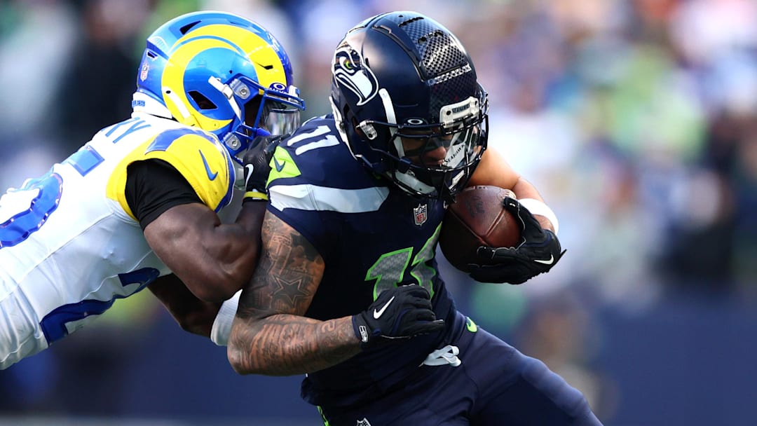 Jan 25, 2026; Seattle, WA, USA; Seattle Seahawks wide receiver Jaxon Smith-Njigba (11) runs against Los Angeles Rams cornerback Roger McCreary (25) during the first half in the 2026 NFC Championship Game at Lumen Field. Mandatory Credit: Kevin Ng-Imagn Images