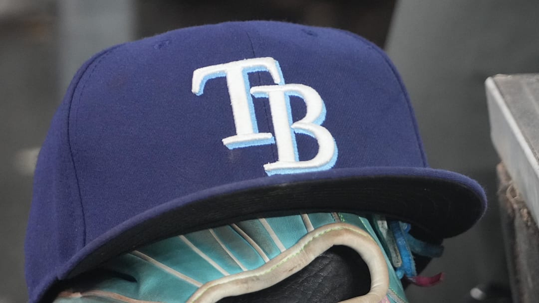 Sep 26, 2025; Toronto, Ontario, CAN; The hat and glove of Tampa Bay Rays third baseman Junior Caminero (13) in the dugout during the game against the Toronto Blue Jays at Rogers Centre. 