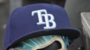 Sep 26, 2025; Toronto, Ontario, CAN; The hat and glove of Tampa Bay Rays third baseman Junior Caminero (13) in the dugout during the game against the Toronto Blue Jays at Rogers Centre. 