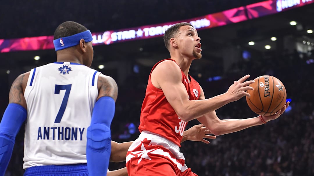 Feb 14, 2016; Toronto, Ontario, CAN; Western Conference guard Stephen Curry of the Golden State Warriors (30) shoots against Eastern Conference player Carmelo Anthony (7) in the first half of the NBA All Star Game at Air Canada Centre. Mandatory Credit: Bob Donnan-Imagn Images