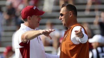 Oct 8, 2022; Dallas, Texas, USA;  Oklahoma head coach Brent Venables (left) speaks with Texas head coach Steve Sarkisian (right).