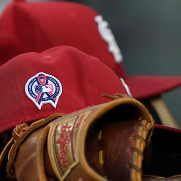 Sep 11, 2023; Baltimore, Maryland, USA;  A detailed view of the 9/11 ribbon on a St. Louis Cardinals hat in the dugout before the game against the Baltimore Orioles at Oriole Park at Camden Yards. Mandatory Credit: Tommy Gilligan-Imagn Images
