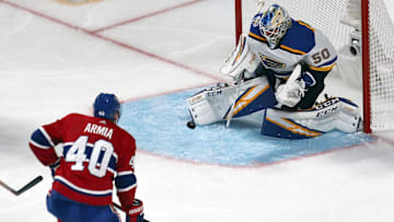 Oct 12, 2019; Montreal, Quebec, CAN; St. Louis Blues goaltender Jordan Binnington (50) makes a save against Montreal Canadiens right wing Joel Armia (40) during the second period at Bell Centre. Mandatory Credit: Jean-Yves Ahern-Imagn Images