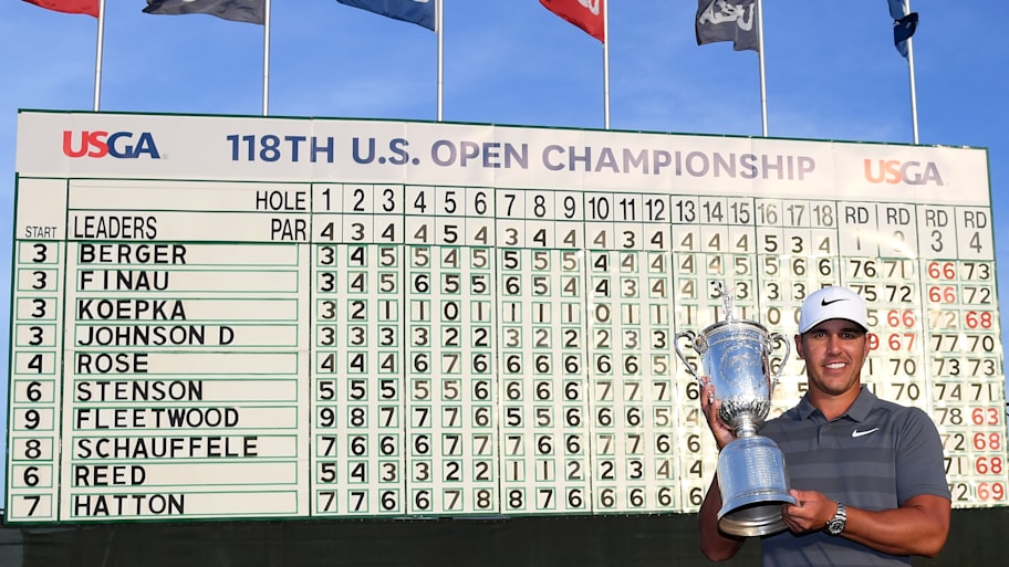 Brooks Koepka celebrates with the winners trophy after the final round of the 2018 U.S. Open at Shinnecock Hills Golf Club.