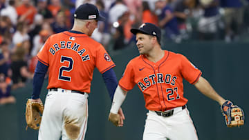 Jun 14, 2024; Houston, Texas, USA;  Houston Astros third baseman Alex Bregman (2) and second baseman Jose Altuve (27) celebrate the win against the Detroit Tigers at Minute Maid Park. Mandatory Credit: Thomas Shea-Imagn Images