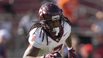 Oct 5, 2024; Stanford, California, USA;  Virginia Tech Hokies linebacker Keonta Jenkins (7) runs with the ball after intercepting it against the Stanford Cardinal during the fourth quarter at Stanford Stadium. Mandatory Credit: Stan Szeto-Imagn Images