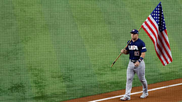 Mar 21, 2023; Miami, Florida, USA; USA center fielder Mike Trout (27) carries the American flag