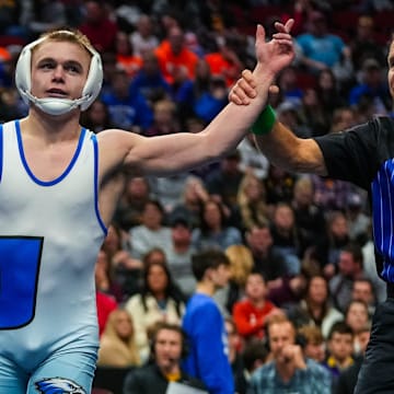 Underwood's Gable Porter  gets his hand raised after defeating North Butler-Clarksville's Tanner Arjes at 132 pounds during the championship round of the Class 1A of the Iowa high school state wrestling tournament at Wells Fargo Arena in Des Moines on Saturday, Feb. 18, 2023.