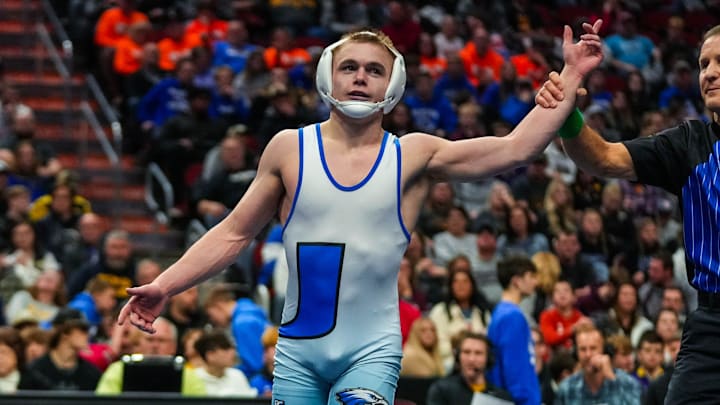 Underwood's Gable Porter  gets his hand raised after defeating North Butler-Clarksville's Tanner Arjes at 132 pounds during the championship round of the Class 1A of the Iowa high school state wrestling tournament at Wells Fargo Arena in Des Moines on Saturday, Feb. 18, 2023.