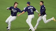 Tampa Bay's Brett Phillips (left) celebrates with Hunter Renfroe (11) and Willy Adames during the 2020 World Series.