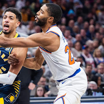 Feb 11, 2025; Indianapolis, Indiana, USA; Indiana Pacers guard Tyrese Haliburton (0) shoots the ball while New York Knicks forward Mikal Bridges (25) defends in the first half at Gainbridge Fieldhouse. Mandatory Credit: Trevor Ruszkowski-Imagn Images