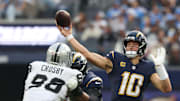 Nov 30, 2025; Inglewood, California, USA; Los Angeles Chargers quarterback Justin Herbert (10) drops back to pass against the Las Vegas Raiders during the first half at SoFi Stadium. Mandatory Credit: Kiyoshi Mio-Imagn Images