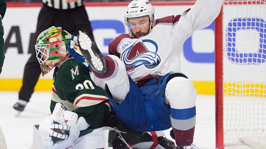 May 9, 2026; Saint Paul, Minnesota, USA; Colorado Avalanche center Nicolas Roy (10) collides with Minnesota Wild goaltender Jesper Wallstedt (30) in the third period of game three of the second round of the 2026 Stanley Cup Playoffs at Grand Casino Arena. Mandatory Credit: Matt Blewett-Imagn Images