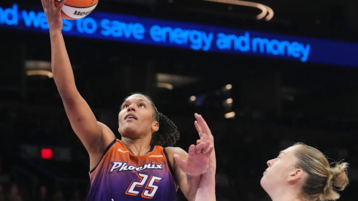Mercury forward Alyssa Thomas (25) lays the ball up past New York Liberty center Emma Meesseman (33)at PHX Arena, Aug. 30, 2025, in Phoenix. Mercury forward Alyssa Thomas (25) lays the ball up past New York Liberty center Emma Meesseman (33)at PHX Arena, Aug. 30, 2025, in Phoenix.
