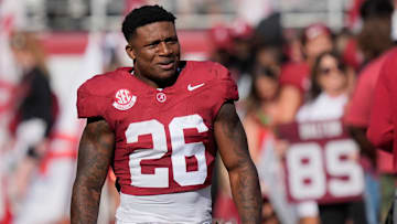 Nov 22, 2025; Tuscaloosa, Alabama, USA; Alabama running back Jam Miller (26) walks to his family with a rose in hand on Senior Day at Saban Field at Bryant-Denny Stadium.