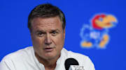 Oct 23, 2024; Kansas City, MO, USA; Kansas Jayhawks head coach Bill Self talks to media during the Big 12 Men’s Basketball Media Day at T-Mobile Center. Mandatory Credit: Jay Biggerstaff-Imagn Images