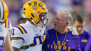 Oct 11, 2025; Baton Rouge, Louisiana, USA;  LSU Tigers head coach Brian Kelly talks to wide receiver Zavion Thomas (0) against the South Carolina Gamecocks during the first half at Tiger Stadium. Mandatory Credit: Stephen Lew-Imagn Images